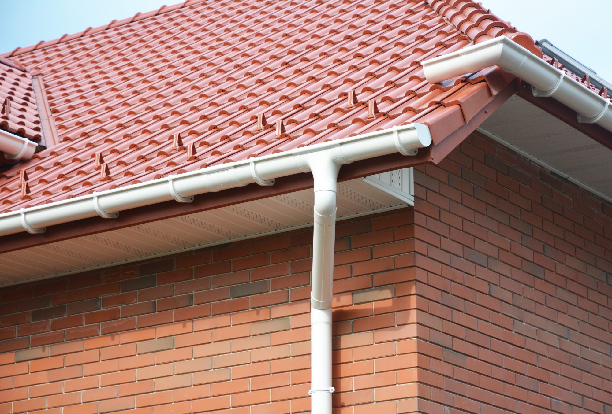 Close up on House Problem Areas for Rain Gutter Waterproofing Outdoor. Home Guttering, Roofing Construction, Gutters, Plastic Guttering System, Roof Tiles, Guttering & Drainage Pipe House Building.